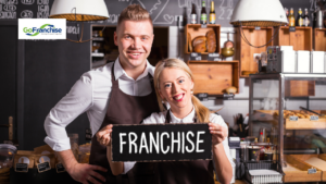 A man and a woman holding up a sign that says 'Franchise'